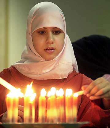 Muslim woman with candles
